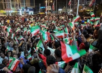 People in Hargeisa wave Somaliland and United States flags during celebrations following Donald Trump’s comments