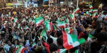 People in Hargeisa wave Somaliland and United States flags during celebrations following Donald Trump’s comments