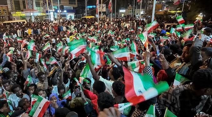People in Hargeisa wave Somaliland and United States flags during celebrations following Donald Trump’s comments